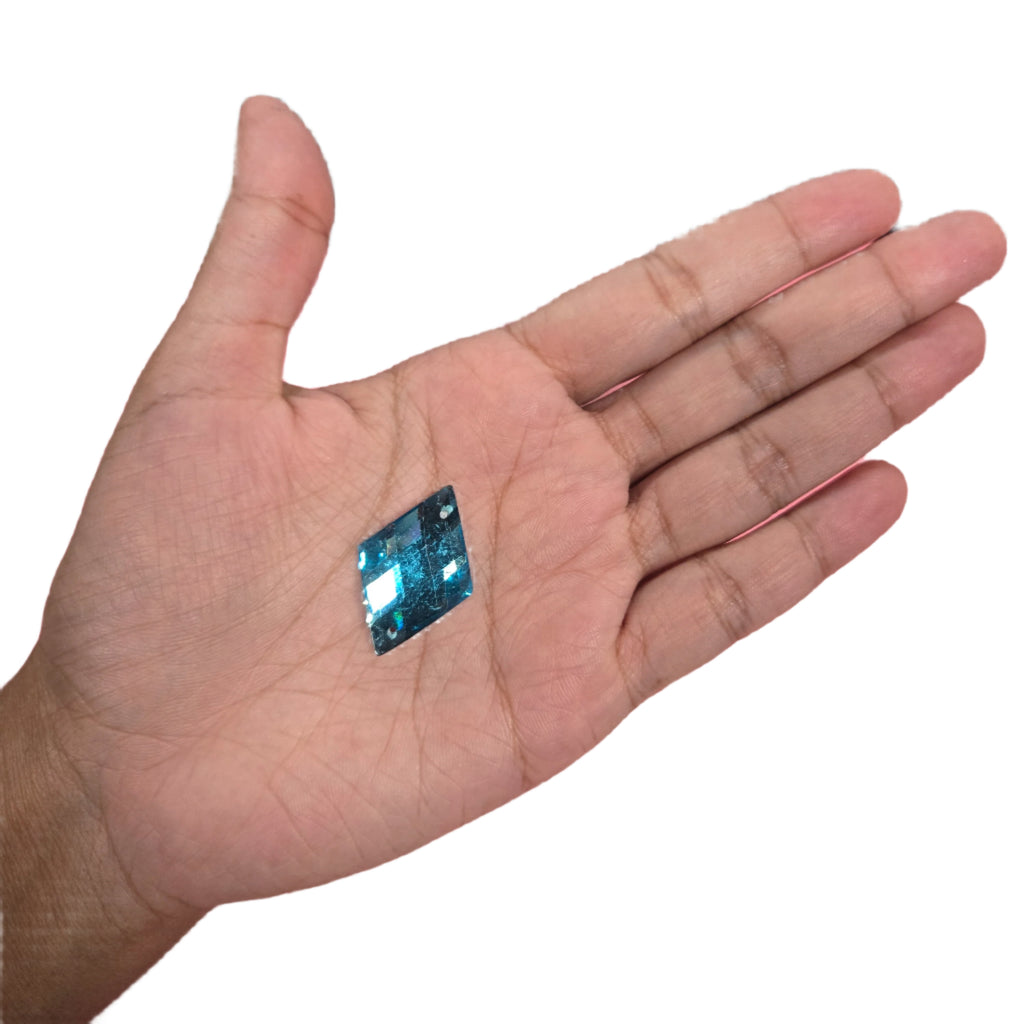 Aqua diamond sew-on flatback rhinestone, 20x29MM, perfect for adding vibrant color to carnival costumes and custom designs. #carnivalmw #carnivalsupplies