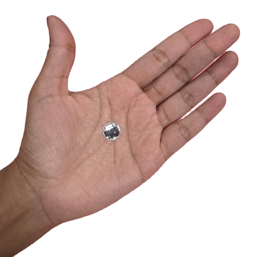 Close-up of a 12mm clear circle flatback rhinestone with a square pattern, ideal for adding elegance to carnival costumes and custom designs. Perfect for gluing onto accessories for a unique and sparkling look. #carnivalmw #carnivalsupplies #wirebra