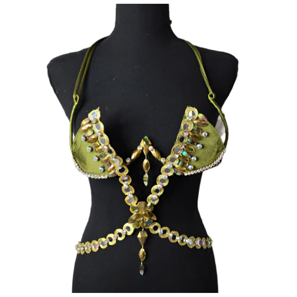 Golden Olive Mirage Decorated Wire Bra featuring olive green cups embellished with gold and iridescent gemstones, a gemstone harness detail, and hanging jewels, displayed on a black mannequin—perfect for festivals, carnivals, and performance wear