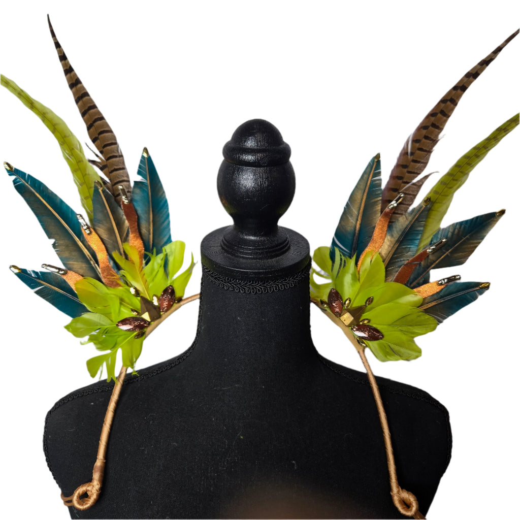 Jungle Luxe Feather Shoulder Wings featuring vibrant green, gold, and earthy-toned feathers, designed for carnivals, festivals, and performances. Lightweight and luxurious, perfect for show-stopping events. #carnivalmw
