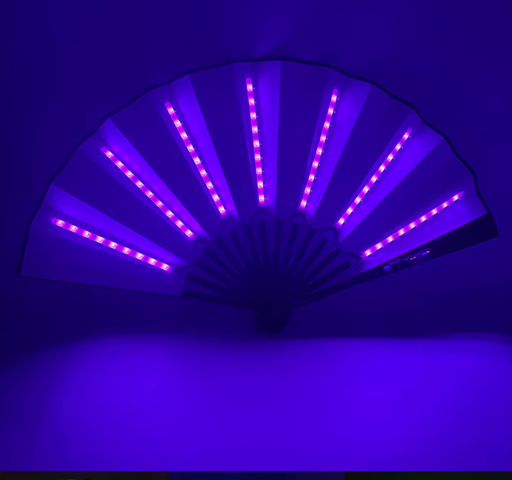 "LED Glow Foldable Hand Fan featuring vibrant glowing LED lights with fluorescent discoloration. Lightweight, foldable, and perfect for festivals, carnivals, and nighttime events. #carnivalmw"