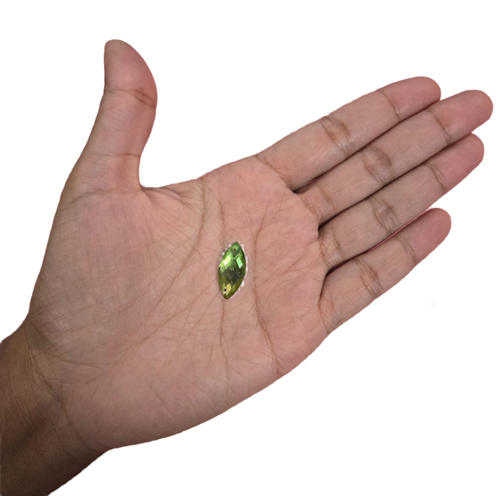 Detailed view of a 13x19mm lime green marquise sew-on flatback rhinestone, ideal for enhancing carnival costumes and custom designs. Perfect for sewing onto accessories for a vibrant and unique finish. #carnivalmw #carnivalsupplies #wirebra