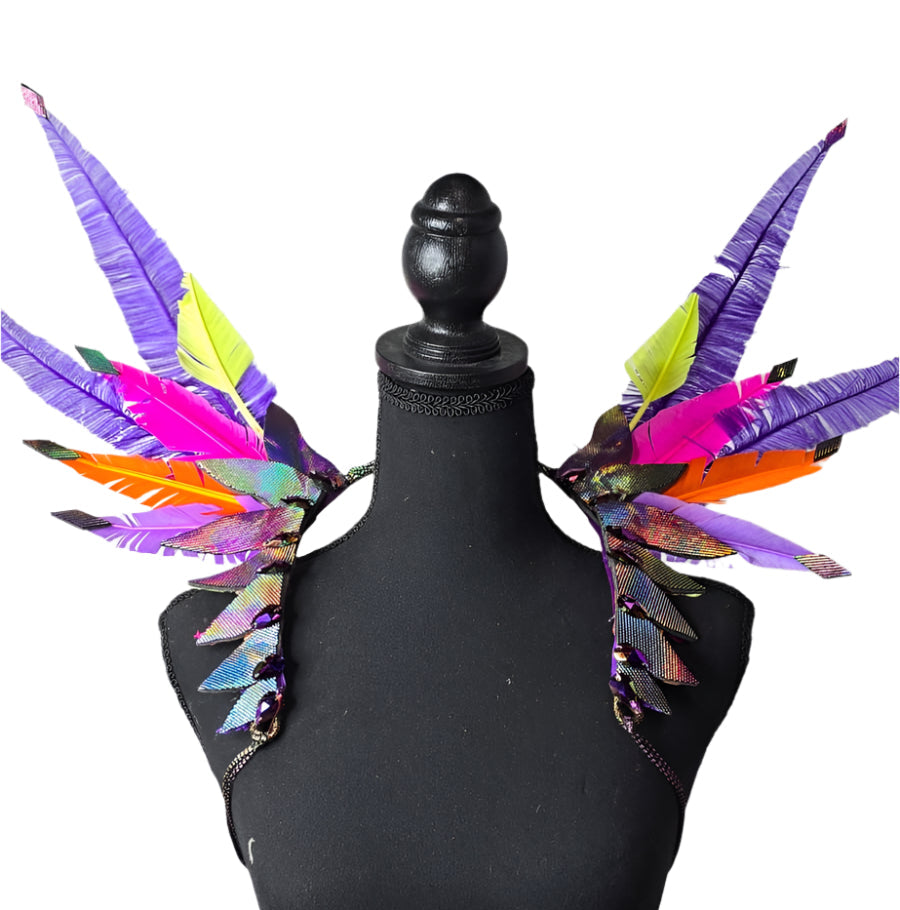 Purple Rain Feather Small Collar Wings featuring vibrant purple, silver, and midnight blue feathers with sparkling accents, designed for carnival and festival wear. Lightweight, adjustable, and handmade for a dramatic and elegant look. #CARNIVALFEATHERS #CARNIVAL #CARNIVALCOSTUMES