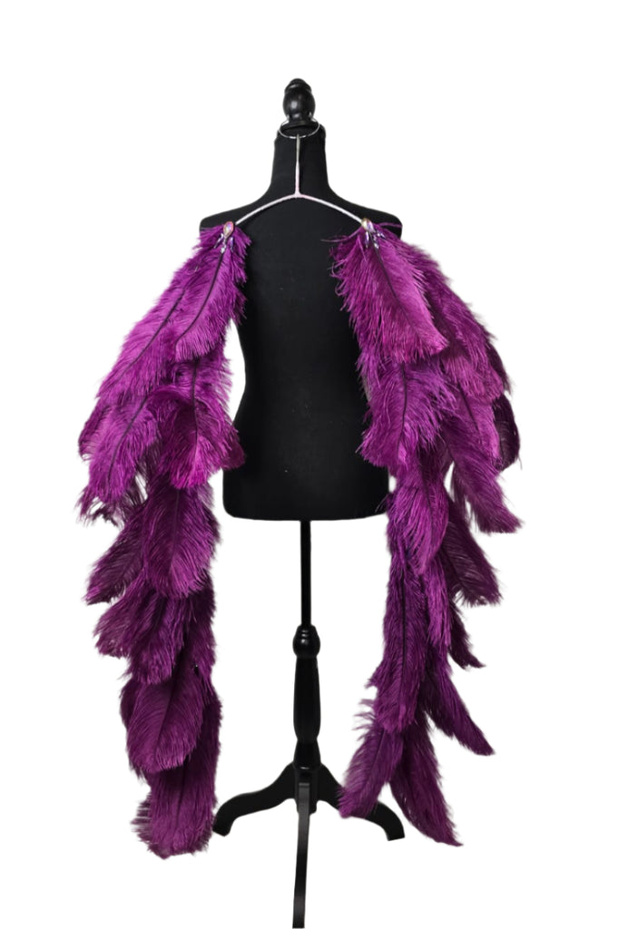 Purple Plum Feather Tail featuring deep purple ostrich plumes and sparkling gems; lightweight, adjustable, and handmade to attach easily to any carnival backpack for an extra dramatic flair. #CARNIVALFEATHERS #CARNIVAL #CARNIVALCOSTUMES
