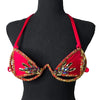 Red flame crystal decorated wire bra with gold rhinestone trim on a black mannequin, front view. #carnivalmw #festival #festivalwear #festivallooks #wirebra #carnivalcostumes