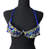 Royal blue decorated wire bra with iridescent AB crystals on a black mannequin, front view. #wirebra #carnival #carnivalcostumes