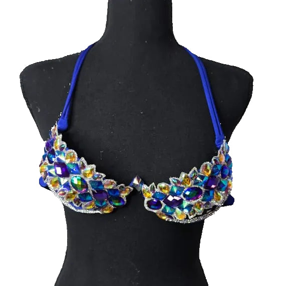Royal blue decorated wire bra with iridescent AB crystals on a black mannequin, front view. #wirebra #carnival #carnivalcostumes