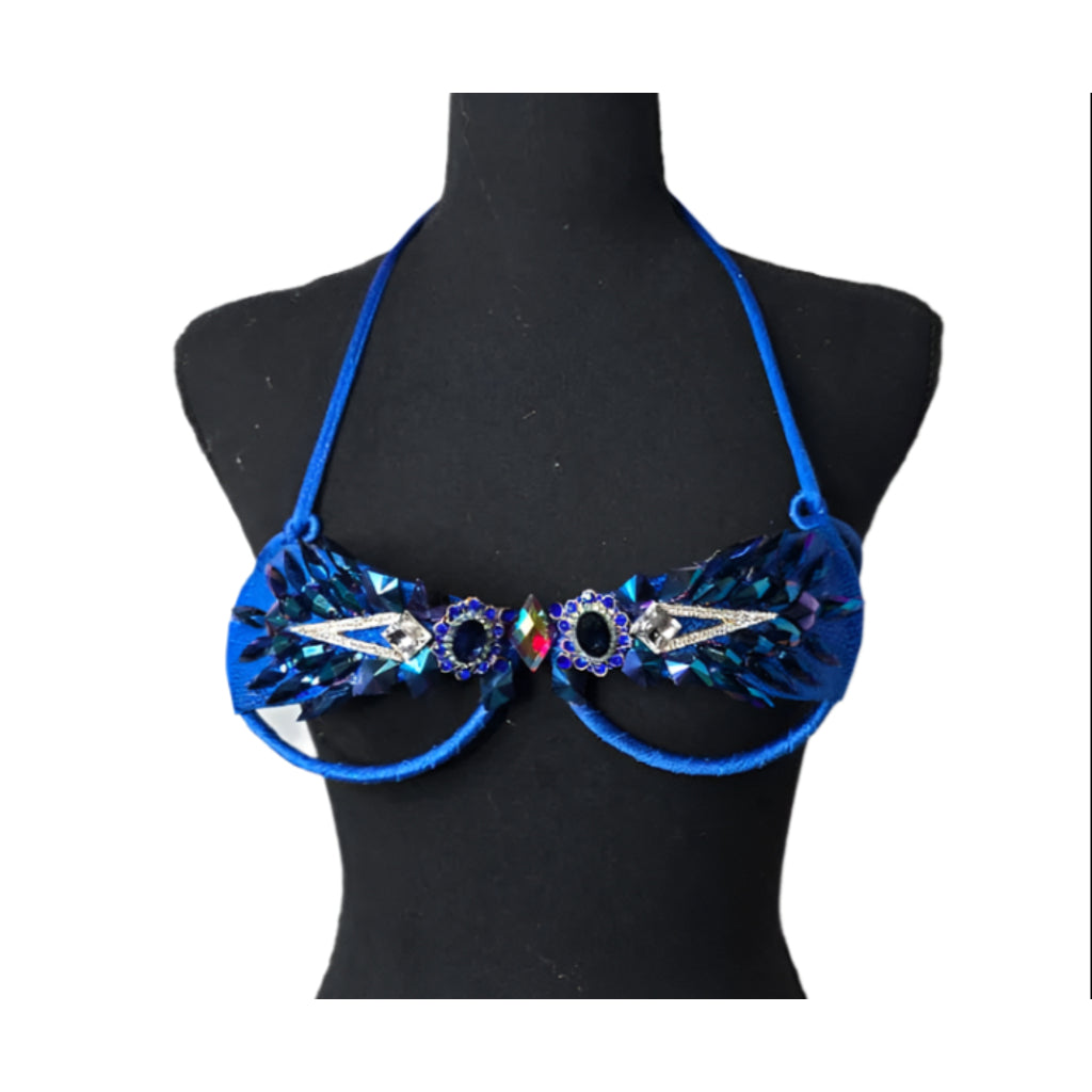 Sapphire Blaze Decorated Wire Bra featuring a vivid sapphire blue base, shimmering blue and silver gem embellishments, and radiant iridescent accents, displayed on a black mannequin—perfect for carnivals, samba dancers, and festival performances