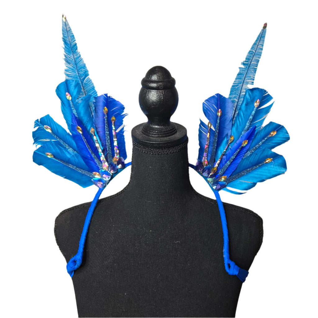 A vibrant set of Sparkling Blue Feather Small Collar Wings displayed on a mannequin. The wings feature bold blue feathers adorned with shimmering gem accents, creating a radiant and eye-catching design. Perfect for carnivals, festivals, and performances, the wings are lightweight and stylish, adding a touch of glamour to any outfit. #carnivalmw