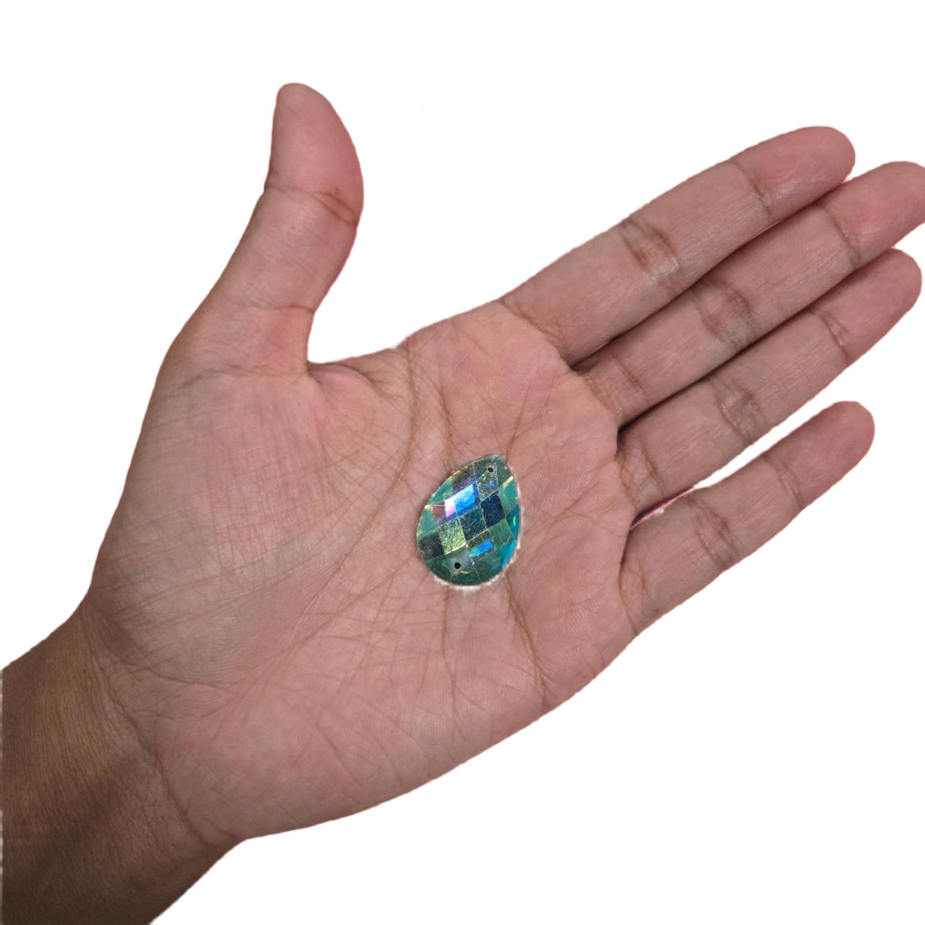 Detailed view of a Teal Teardrop AB Sew-On Rhinestone 18x26MM ideal for enhancing carnival costumes and custom designs. Perfect for gluing onto accessories for a sparkling and unique finish. #carnivalmw #carnivalsupplies #wirebra