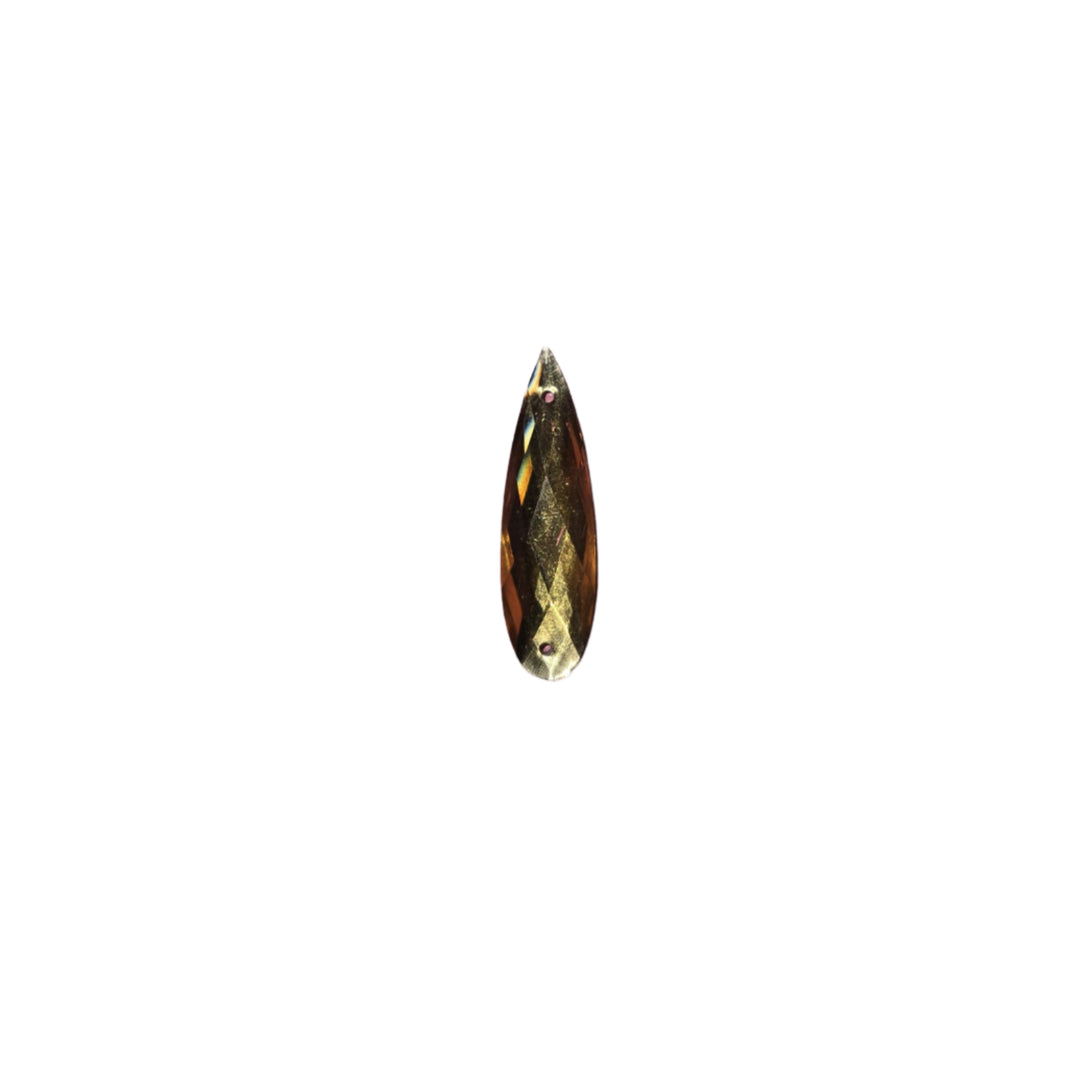 Close-up of a 6x27mm yellow Teardrop sew-on flatback rhinestone, perfect for adding a vibrant touch to carnival costumes and custom designs