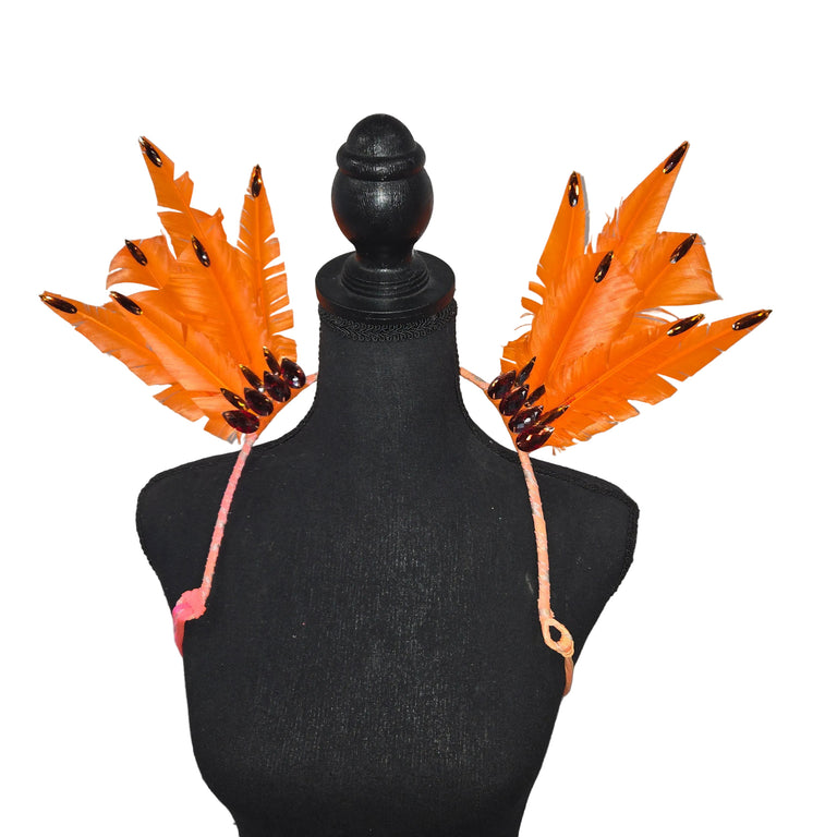 Amber Crown small feather collar wings on a mannequin – orange feathers with amber rhinestone tips, garnet teardrop gems and peach straps | CarnivalMW