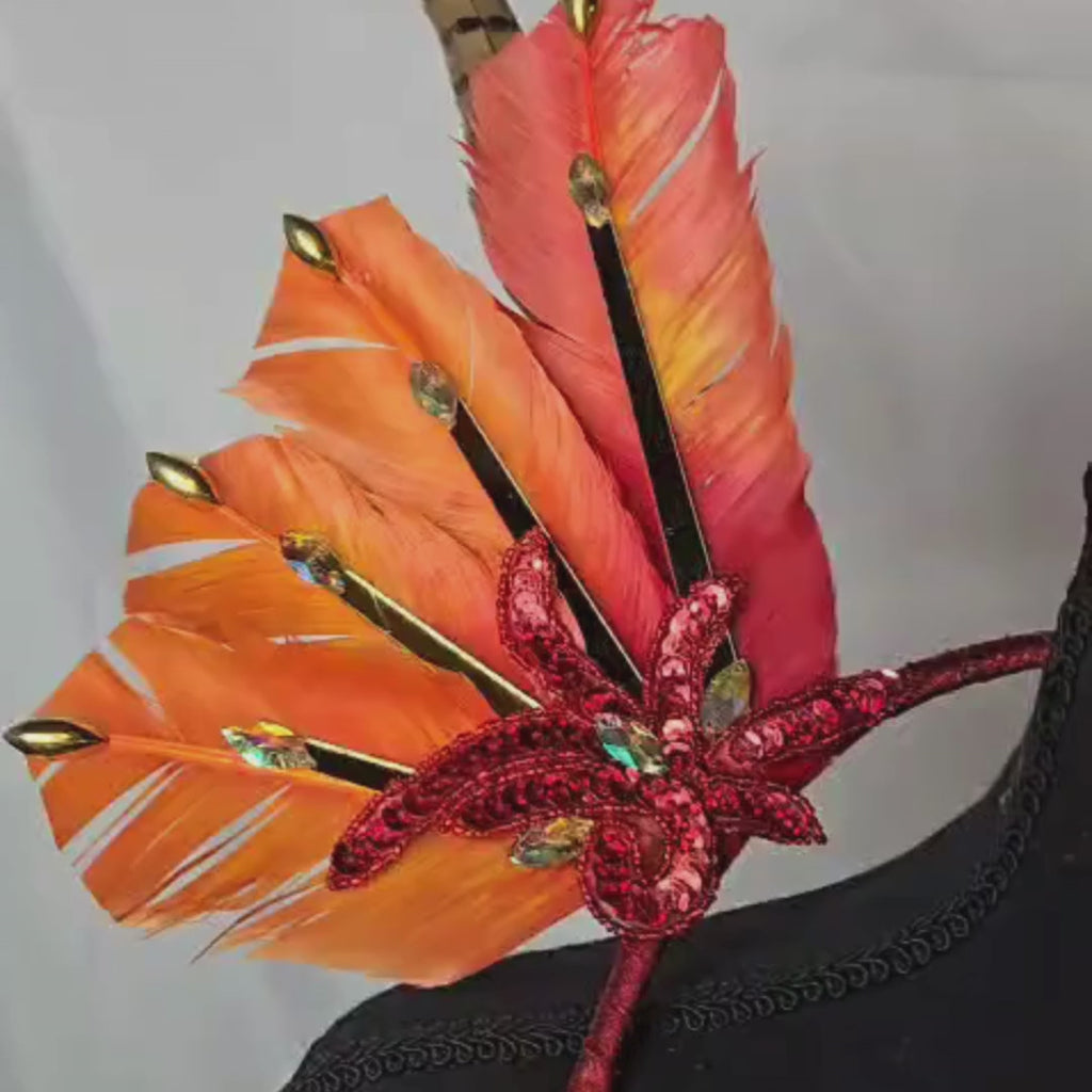 Fiery Sunset Feather Small Collar Wings featuring vibrant orange feathers, shimmering gold accents, and bold red details. Perfectly handcrafted, this lightweight and radiant accessory is designed to sit gracefully around the neck and shoulders, ideal for carnivals, festivals, and performances. #carnivalmw
