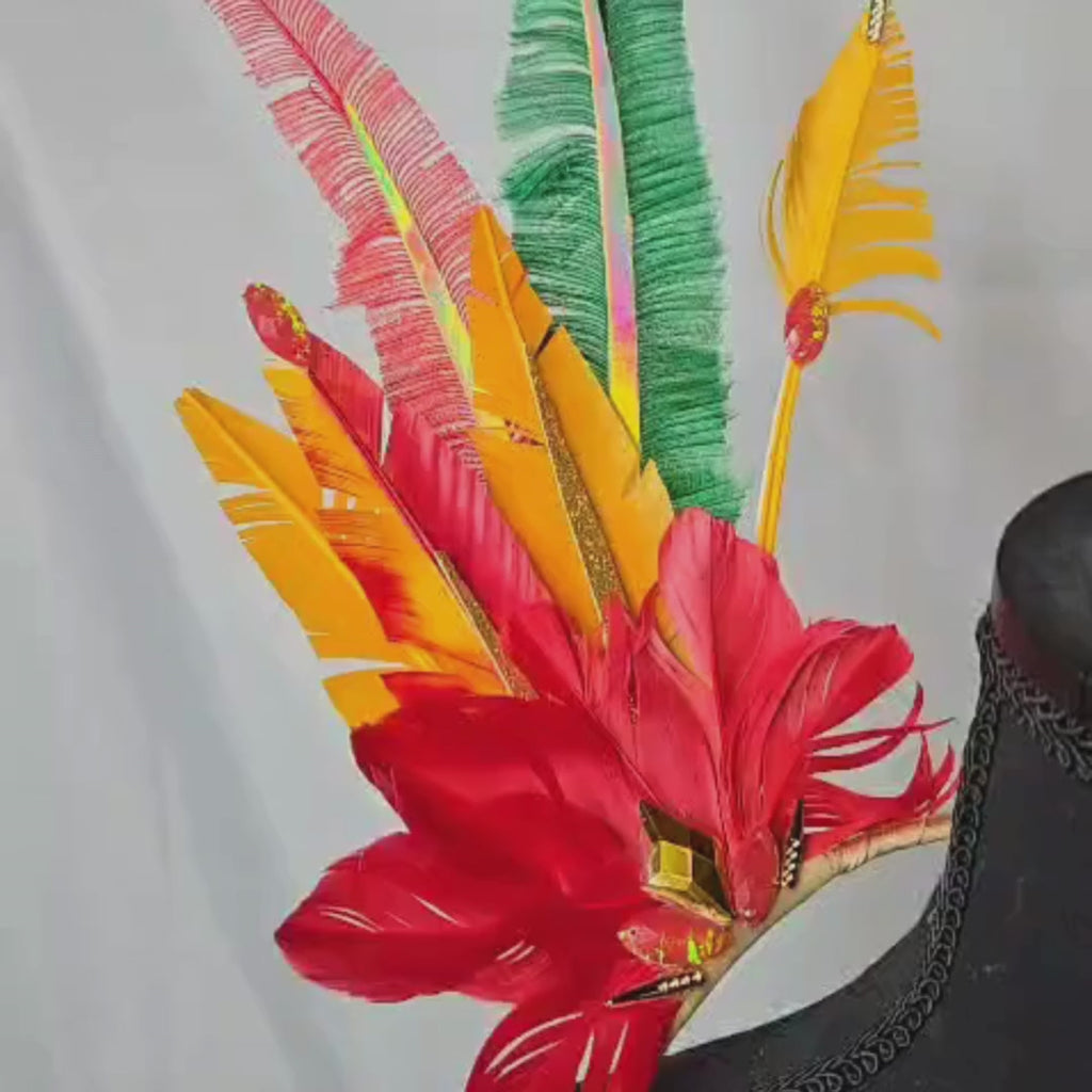 Video of Amazonia Glow Feather Small Collar Wings featuring a vibrant mix of green, gold, and earthy-toned feathers with shimmering accents. Lightweight and perfect for festivals, carnivals, and performances. #carnivalmw