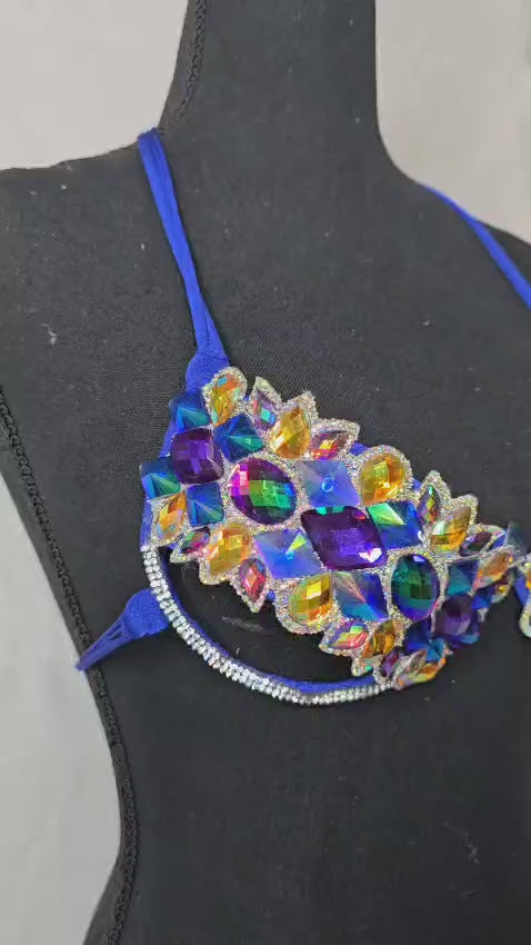 Video of Royal blue decorated wire bra with iridescent AB crystals on a black mannequin, front view