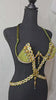 Golden Olive Mirage Decorated Wire Bra featuring olive green cups embellished with gold and iridescent gemstones, a gemstone harness detail, and hanging jewels, displayed on a black mannequin—perfect for festivals, carnivals, and performance wear. #CarnivalMW #FestivalFashion #CarnivalReady #WireBra