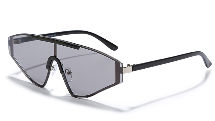 A pair of Vibes Sunglasses featuring a full lens design extending to the arms, showcasing a unique chunky style inspired by the 90s. The sunglasses have a plastic-based frame with metal accents, and UV400 protected lenses, available in various vibrant colors. #carnivalmw #carnivalcostume #mondaywear #carnival